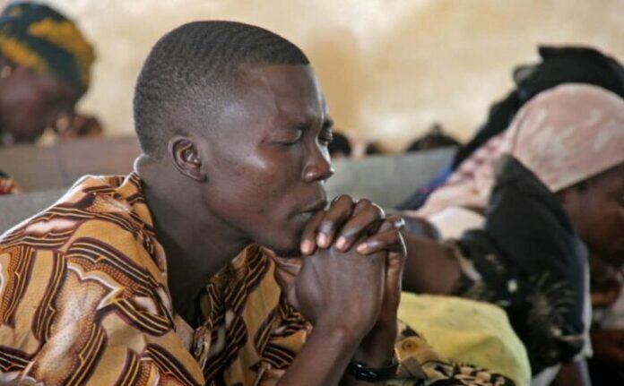 Cameroon man praying